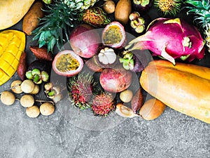 Various fresh Thai fruits - rambutan, mango, mangosteen, longan, papaya, dragon fruit, sapodilla, passion fruit, salak, pineapple