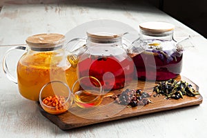 Various fruit teas in teapots
