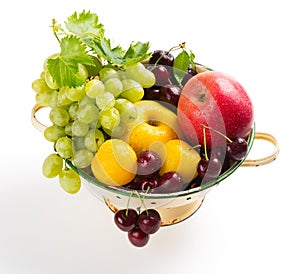 Various fruits in colander