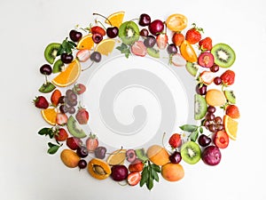 Various fruits frame on white background. Different berries and fruits on white background. Copy space.