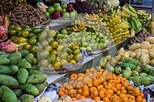 Various fruits on a shelf in Asian food market