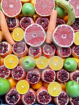 Various fruits sliced in half. Turkish fruit market. Fresh juice