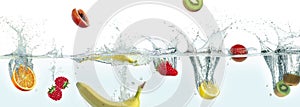 Various fruits splashing in water