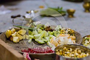 Various fruits and vegetables are kept together in brass plates for performing puja rituals in hindu festivals of Durga Puja, kali