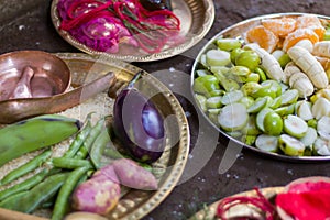 Various fruits and vegetables are kept together in brass plates for performing puja rituals in hindu festivals of Durga Puja, kali