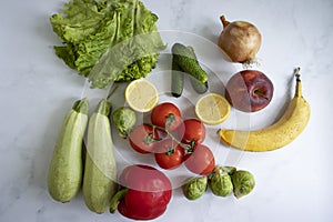 Various fruits and vegetables organic a light background