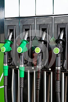 Various fuel nozzles at a gas station. Close-up layout. Refueling a car with petrol, gas, diesel fuel