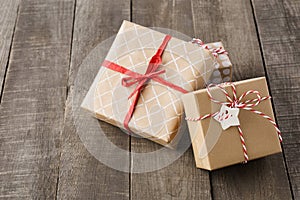 Various gift boxes decorated with red ribbon and twine