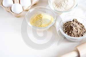 Various gluten free flour corn,sesame,oat,coconut in glass bowl on white background