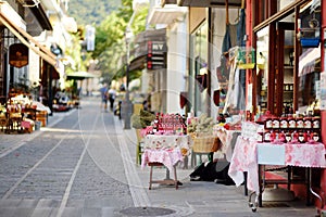 Various goods sold at small shops at the pedestrian area at center of Kalavryta town near the square and odontotos train station,