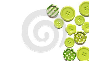 Various green sewing buttons isolated on white background