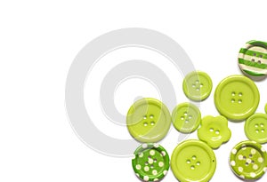 Various green sewing buttons isolated on white background