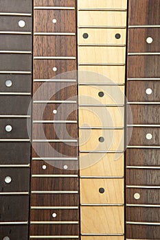 Various guitar necks aligned,