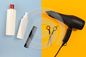 Various hair styling devices on the color blue, yellow paper background, top view