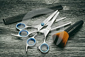 Various hairdressing scissors with brush and hair comb