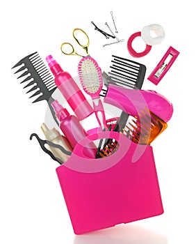 Various hairstyling equipment in shopping bag