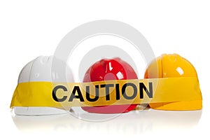 Various hard hats with caution tape