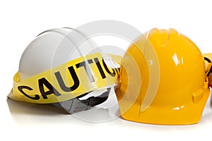 Various hard hats with caution tape