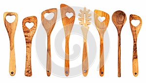 Various heart shape of wooden cooking utensils. Wooden spoons and wooden spatula isolate on white background