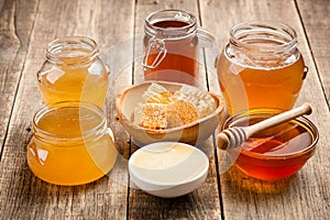 Various honey on wooden table