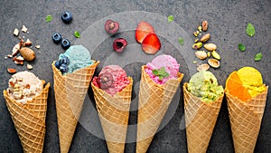 Various of ice cream flavor in cones blueberry , strawberry , pist