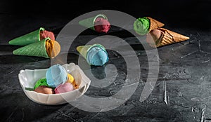 Various of ice cream flavor in cones blueberry, strawberry, pistachio, orange and chocolate setup