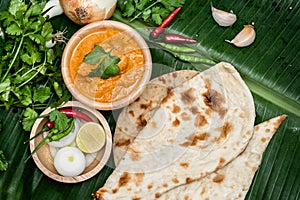 Various indian food menus, biryani rice, butter chicken, tandoori, bean curry and naan bread