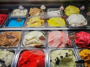 Various italian gelato ice cream flavours in modern shop display