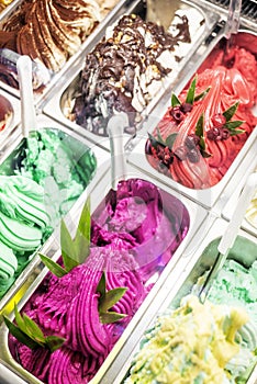 Various italian gelato ice cream flavours in modern shop display photo