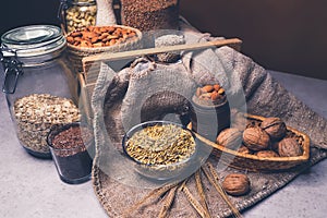 Various jars of nuts and cereals. Sources of protein and trace elements.