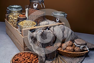 Various jars of nuts and cereals. Sources of protein and trace elements.