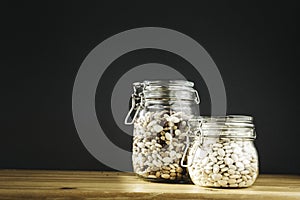 Various of kidney beans. Red, white and black kidney beans in glass storage containers. Healthy cooking, clean eating, zero waste