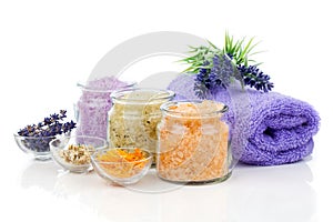 Various kinds of bath salt with flowers photo