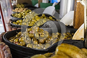 Various kinds of Bowls with olives for sale at a spanish market street