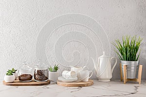 Various kitchen utensils on a marble white countertop. modern kitchen decor concept. an empty space for your text