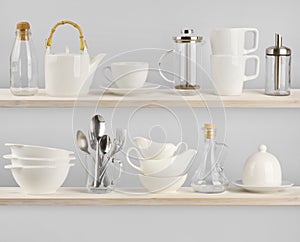 Various kitchen utensils on wooden shelves