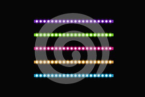Various LED stripes on a black background, glowing LED garlands. Set of pink, yellow, purple, blue, green glowing