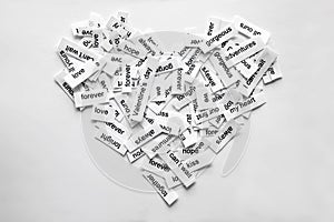 Various love messages printed on pieces of paper photo