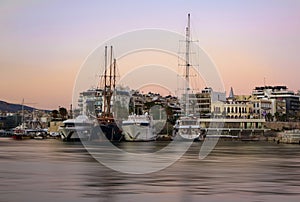 various and Luxurious yachts at sunset.