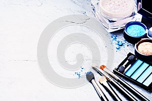 Various makeup products in blue tone