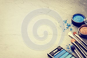 Various makeup products in blue tone