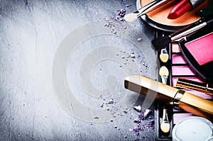 Various makeup products on dark background