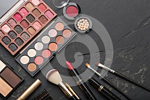 Various Makeup Products on Dark Background with Copyspace