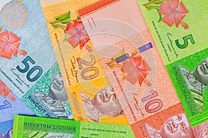 Different banknotes of Malaysian ringgit currency on flat surface
