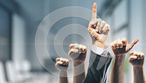 Various male and female hands showing thumbs up on office interior wall wallpaper