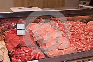 Various meat in a supermarket. Raw meat at butcher shop