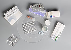 Various medicine bottles and different pills blister pack