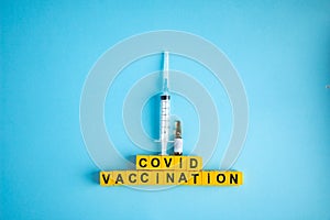 Various medicines on blue background for Vaccination against  Corona Virus. Concept of fight against coronavirus, vaccination,