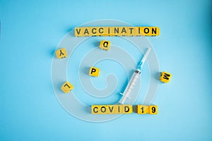 Various medicines on blue background for Vaccination against  Corona Virus. Concept of fight against coronavirus, vaccination,