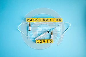 Various medicines on blue background for Vaccination against  Corona Virus. Concept of fight against coronavirus, vaccination,